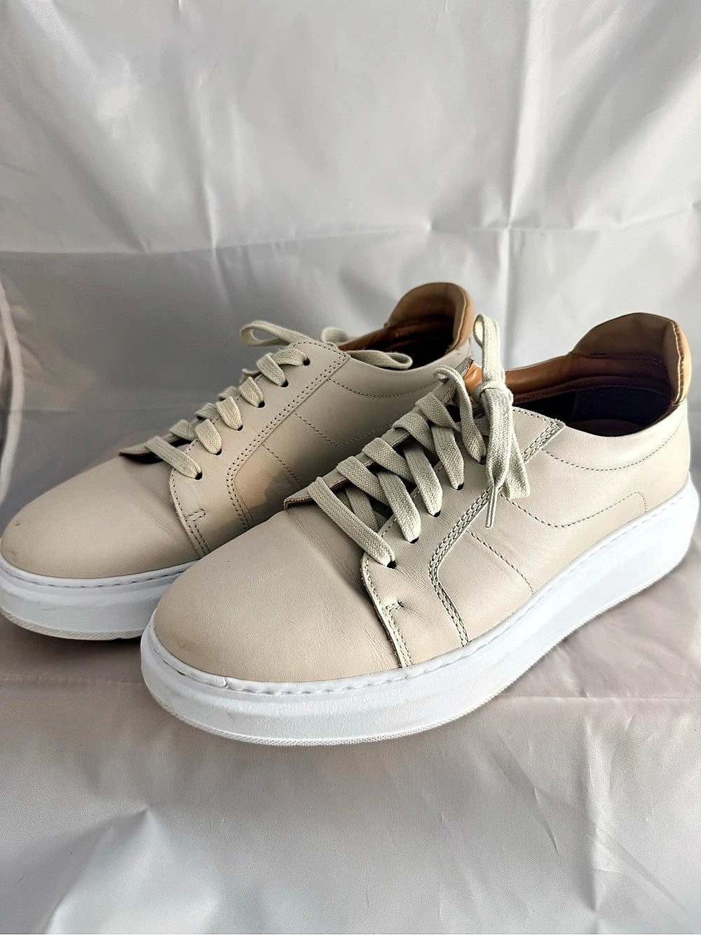 Low-top Aquatalia leather sneakers in a light beige